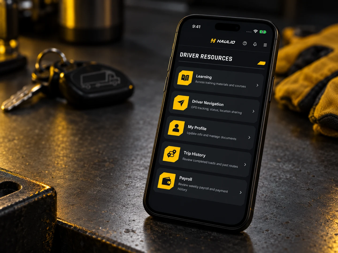 Haulio Driver Resources mobile interface with Learning, Driver Navigation, My Profile, Trip History and Payroll
